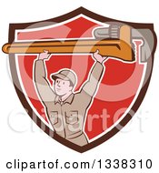Poster, Art Print Of Retro Cartoon White Male Plumber Holding A Giant Monkey Wrench Over His Head Emerging From A Brown White And Red Shield
