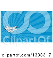 Clipart Of A Cartoon White Male Mechanic Holding Up A Giant Wrench And Blue Rays Background Or Business Card Design Royalty Free Illustration