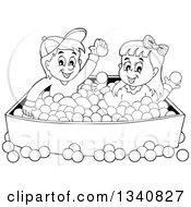 Cartoon Black And White Boy And Girl Playing In A Ball Pit