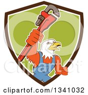 Poster, Art Print Of Cartoon Bald Eagle Plumber Man Holding Up A Monkey Wrench Emerging From A Brown White And Green Shield