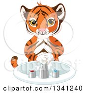 Poster, Art Print Of Cute Tiger Cub Washing His Hands