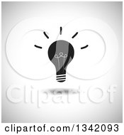 Clipart Of A Shining Black Light Bulb Over Shading Royalty Free Vector Illustration