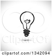 Clipart Of A Black Light Bulb Over Shading Royalty Free Vector Illustration