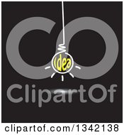 Poster, Art Print Of Suspended White And Yellow Idea Text Light Bulb On Black