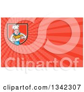 Poster, Art Print Of Cartoon Caucasian Male Chef Baker Holding A Loaf Of Bread In A Shield And Red Rays Background Or Business Card Design