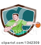 Retro Cartoon Male Handball Player In Action Emerging From A Brown White And Teal Shield