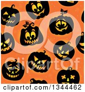 Clipart Of A Seamless Background Pattern Of Illuminated Halloween Jackolantern Pumpkins Over Orange Royalty Free Vector Illustration