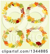 Clipart Of Colorful Autumn Leaf Wreaths Over Yellow Royalty Free Vector Illustration
