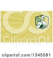 Clipart Of A Retro Male Plumber Holding A Monkey Wrench In A Shield And Pastel Green Rays Background Or Business Card Design Royalty Free Illustration