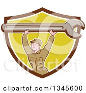 Clipart Of A Cartoon Proud White Male Mechanic Lifting A Giant Wrench Over His Head In A Brown White And Yellow Shield Royalty Free Vector Illustration