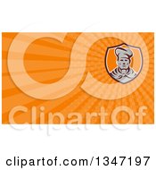 Clipart Of A Retro Male Chef Wearing A Toque And Uniform In A Shield And Orange Rays Background Or Business Card Design Royalty Free Illustration