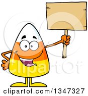 Poster, Art Print Of Cartoon Halloween Candy Corn Character Holding Up A Blank Wood Sign