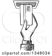 Black And White Sketched Hand Inserting A Card In To An Atm Machine