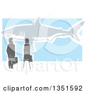 Rear View Of A Woodcut Business Man And Woman Watching A Great White Shark