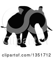 Clipart Of A Black Silhouetted Elephant Walking 2 Royalty Free Vector Illustration