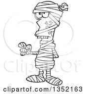 Outline Clipart Of A Cartoon Black And White Halloween Mummy Holding Up A Finger Royalty Free Lineart Vector Illustration by toonaday