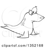 Outline Clipart Of A Cartoon Black And White Staring Seal Royalty Free Lineart Vector Illustration by toonaday