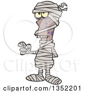 Clipart Of A Cartoon Halloween Mummy Holding Up A Finger Royalty Free Vector Illustration by toonaday