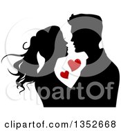 Poster, Art Print Of Black Silhouetted Young Couple About To Kiss Around Red Hearts