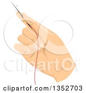 Womans Hand Holding A Needle With Thread
