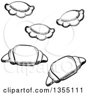 Clipart Of Black And White Sketched Croissants And Ravioli Royalty Free Vector Illustration