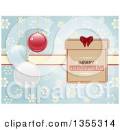 Clipart Of A Merry Christmas Gift Tag And Ribbon Over A Blue Snowflake Pattern With Suspended 3d Baubles Royalty Free Vector Illustration