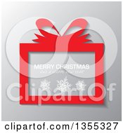 Poster, Art Print Of Red Gift Box With Snowflakes And Merry Christmas And A Happy New Year Greeting Over Gray