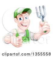 Middle Aged Brunette White Male Gardener In Green Holding A Garden Fork And Thumb Up