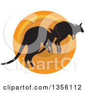 Poster, Art Print Of Silhouetted Kangaroos Hopping Over A Sunset