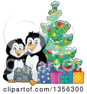 Clipart Of A Cartoon Happy Penguin Family With Gifts By A Christmas Tree Royalty Free Vector Illustration