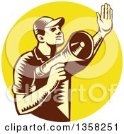 Retro Woodcut Yellow And Brown Male Worker Holding Up A Hand And Using A Megaphone In A Yellow Circle