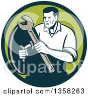 Clipart Of A Retro Male Mechanic Holding A Wrench And Shield In A Green Circle Royalty Free Vector Illustration