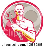 Clipart Of A Retro Male Mechanic Holding A Giant Wrench Over His Chest In A Pink White And Taupe Circle Royalty Free Vector Illustration