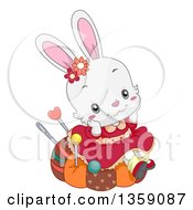 Cute White Female Bunny Rabbit Sitting On A Pin Cushion And Daydreaming