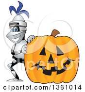 Lancer School Mascot Smiling By A Halloween Jackolantern Pumpkin