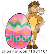 Clipart Of A Horse Colt Bronco Stallion Or Mustang School Mascot Character Posing With A Giant Easter Egg Royalty Free Vector Illustration