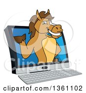 Clipart Of A Horse Colt Bronco Stallion Or Mustang School Mascot Character Emerging From A Desktop Computer Royalty Free Vector Illustration