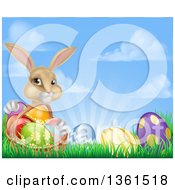 Poster, Art Print Of Cute Beige Bunny Rabbit With A Basket And Easter Eggs In Grass Against A Blue Sky With Puffy Clouds And Sun Rays