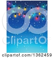 Background Of Colorful Christmas Lights Over Blue With Snow And Text Space