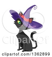 Cute Black Cat Sitting And Wearing A Purple Witch Hat