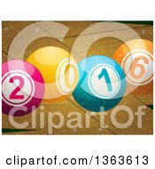 Clipart Of A 3d Colorful New Year 2016 Bingo Balls Over Snow And Wood Royalty Free Vector Illustration