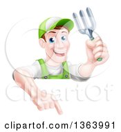 Poster, Art Print Of Middle Aged Brunette White Male Gardener In Green Holding A Garden Fork And Pointing Down Over A Sign