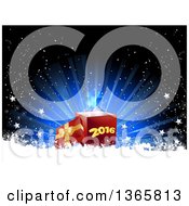 Poster, Art Print Of 3d Red Gift Box With A Gold Bow And The Lid Off With New Year 2016 On The Front Over A Blue Burst And Snow