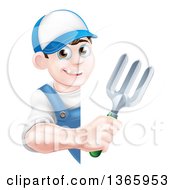 Happy Young Brunette White Male Gardener In Blue Holding A Garden Fork Around A Sign