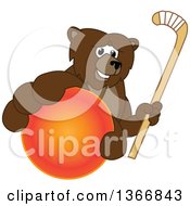 Grizzly Bear School Mascot Character Grabbing A Ball And Holding A Hockey Stick
