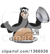 Black Bear School Mascot Character Serving A Roasted Thanksgiving Turkey