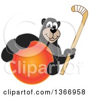 Black Bear School Mascot Character Grabbing A Ball And Holding A Hockey Stick