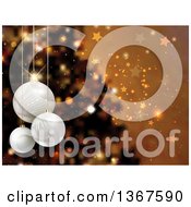 Poster, Art Print Of Christmas Background Of 3d Suspended Baubles Over A Blurred Tree Stars And Bokeh On Gold