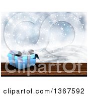 Poster, Art Print Of 3d Short Blue Gift Box On Wood Over A Snowy Landscape
