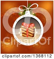 Poster, Art Print Of Christmas Bauble With A Gift Over Red